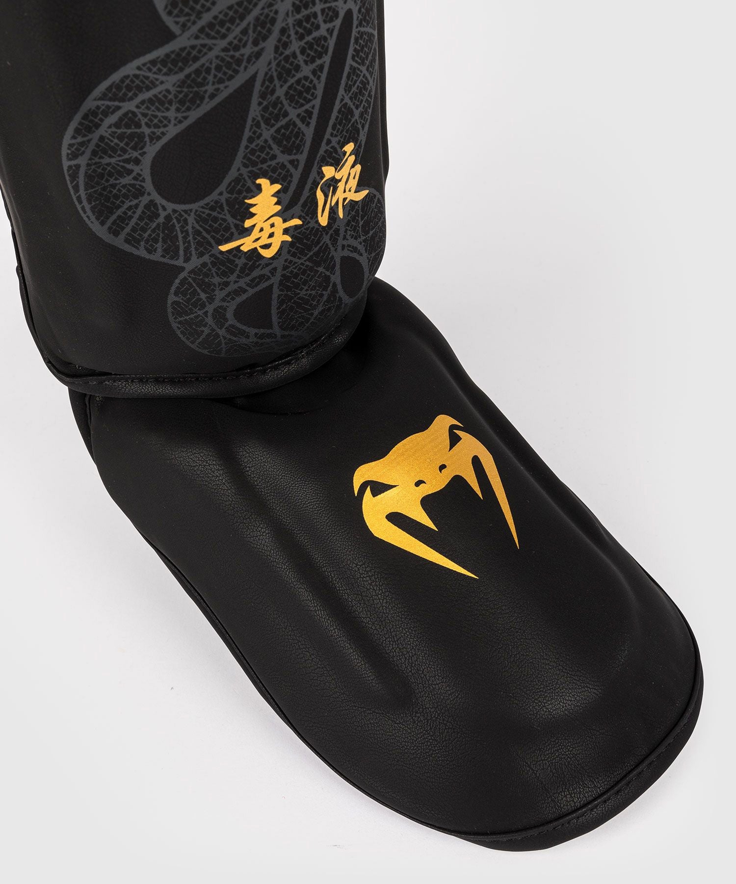Venum Serpenti Shin Guards Black/Silver/Gold - The Fight Club