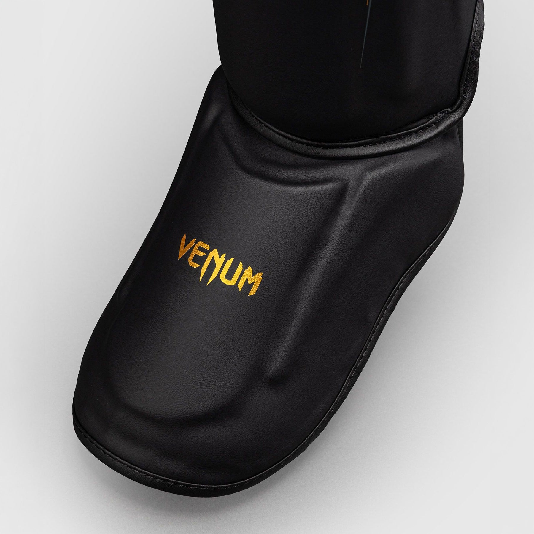 Venum Streamline Shin Guards Black/Gold - The Fight Club